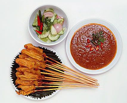 Chicken satay served with side dishes. Pictures, Images and Photos