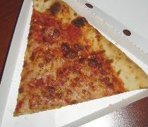 Manolos Pizza & Empanadas A slice of cheese pizza from Manolos Pizza & Empanadas in Urbana, IL